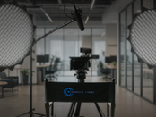 Film studio setup with a director’s chair labeled Chronicle Cinema, surrounded by professional video lights, camera, and microphone. Promotional image for Chronicle Cinema’s Express Production Unit, highlighting fast, cinematic video production with AI-empowered workflows, creative storytelling, and 72-hour turnaround for commercials, interviews, and brand content.
