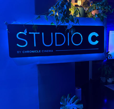 Studio C lobby sign by Chronicle Cinema in Jeffersonville, Indiana, showcasing the Louisville, Kentucky area’s top film and video production studio with modern branding and cinematic design.