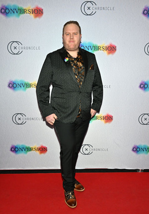 Zach Meiners, filmmaker of Conversion and founder of leading production company Chronicle Cinema, poses on the red carpet at the NYC premiere of the survivor-led, award-winning documentary.