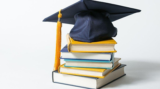 Graduation cap on a stack of books