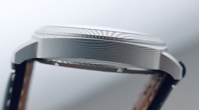 McQuaide Cosmopolitan C1 Midnight Damascus Steel Review British Brand Sports Watch Sellita Caliber Mainspring Watch Magazine