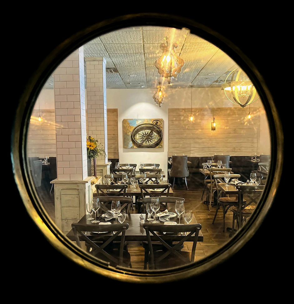 Salt Seafood & Oyster Bar Porthole Looking into Dining Room