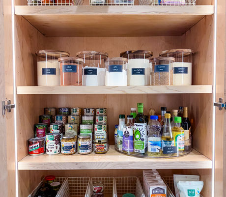 Pantry cabinet organized with labeled bins and jars by KO Luxury Organizing in Aspen, CO