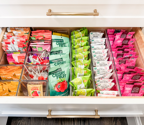 Kids' snack drawer organized with clear divided bins by KO Luxury Organizing in Hilltop, Denver, CO