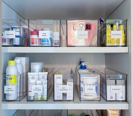 Organized bathroom medicine and backstock cabinet with labeled bins by KO Luxury Organizing in Cherry Hills Village, CO