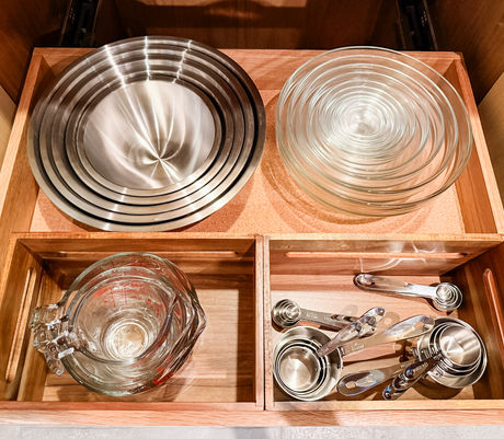 Kitchen drawer organized with mixing bowls and measuring tools by KO Luxury Organizing on the Big Island, Hawaii