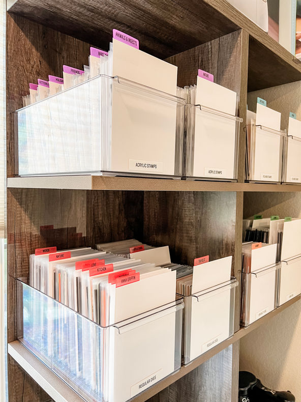 Stamps and dies organized in clear bins with dividers