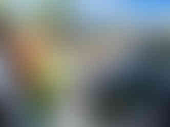 The Junk Truck picking up a large pile of trash and cardboard from a garage organizing project