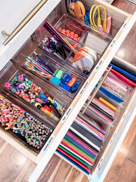 Kid art supplies organized in two drawers. Everything is contained in bins vertically so nothing gets buried.
