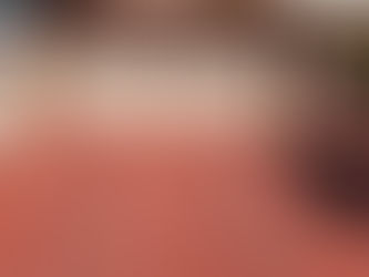 A concrete driveway that has years of sealing product built up on it.