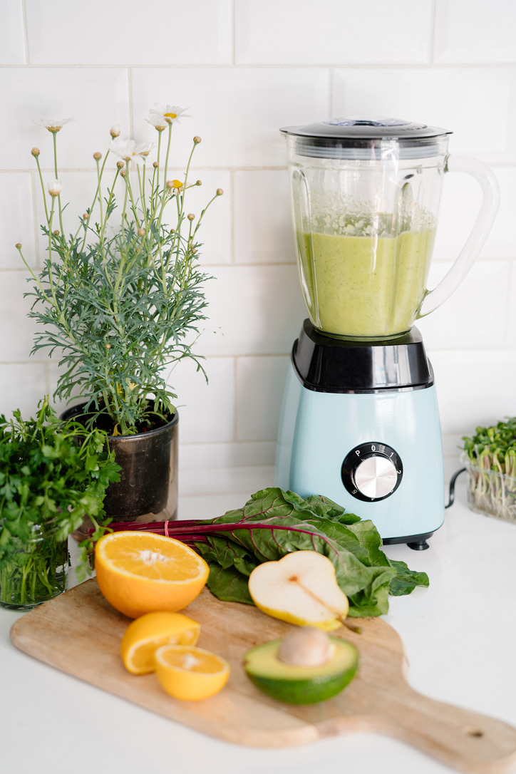 Fresh smoothie being prepared in a bright kitchen