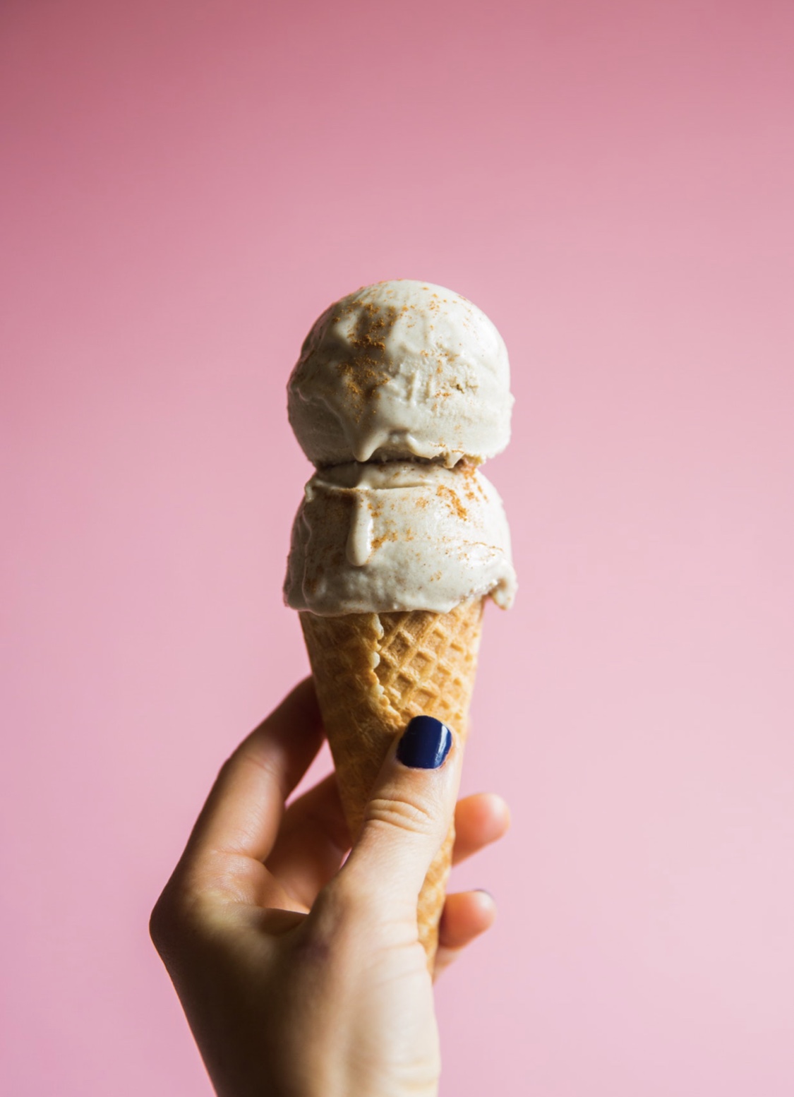 Ice cream against a bright pink background