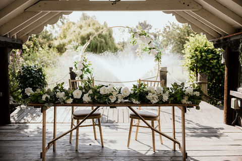 Fountain in the background of lakeside wedding ceremony area at Peterborough venue