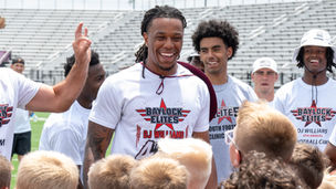 DJ Williams hosted free football camp for more than 100 kids on Wednesday