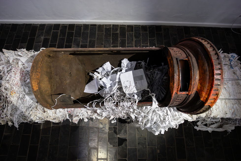 postbox on shredded paper