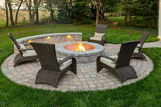Firepit on paver patio with block wall