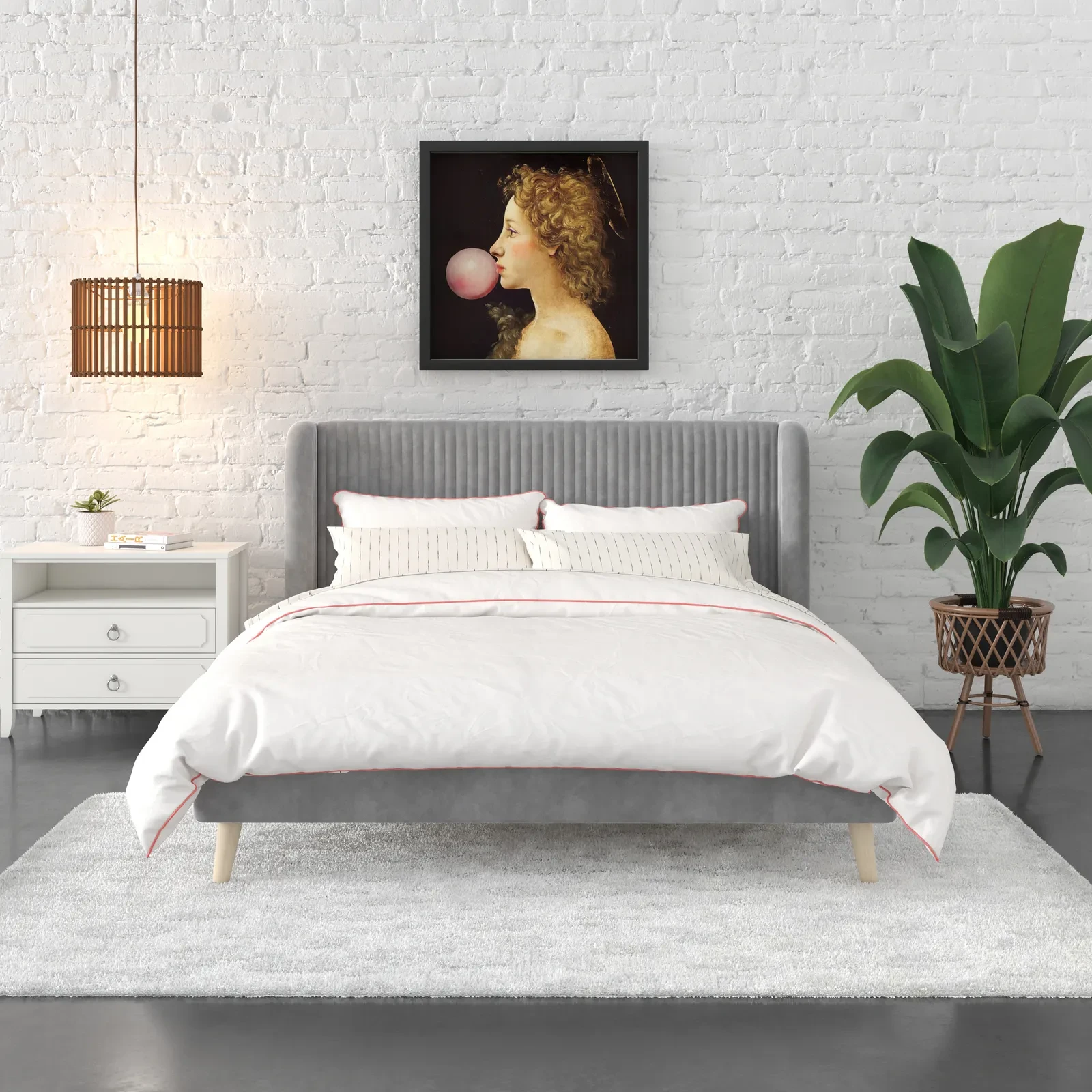 Bed with gray tufted headboard and white bedding in room