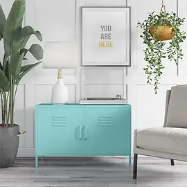 Mint blue locker-style metal cabinet beneath a framed "You Are Here" print, featuring vented double doors, a turntable.