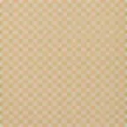 Close up of a rug with a peach and white checkered pattern featuring olive green accent squares at the grid intersections.