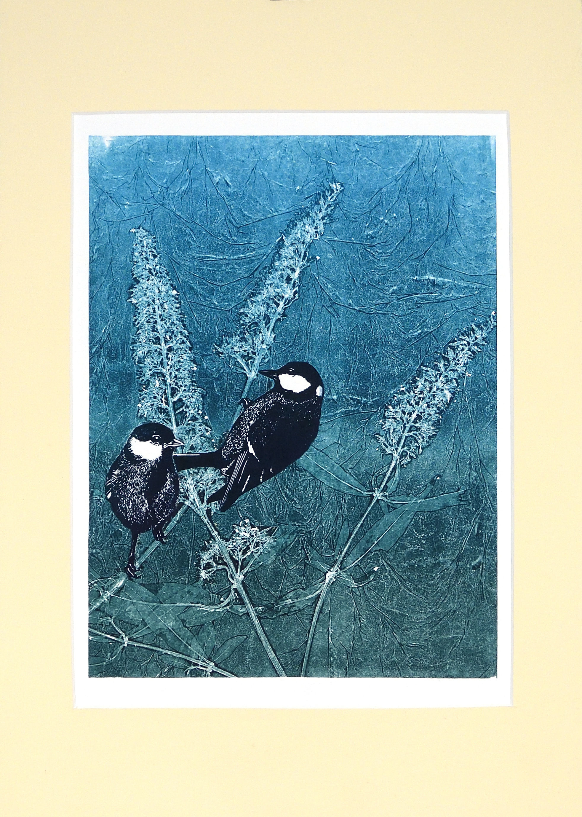 Koolmezen in een vlinderstruik