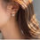 Thumbnail: French Bow Pearly Small Golden Earrings