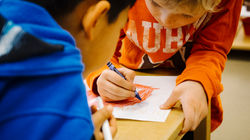 Children drawing with crayons