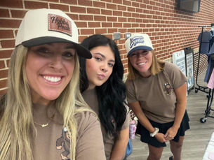 Hobbs Peak Designs team in custom leather patch hats and branded tees at a West Georgia event