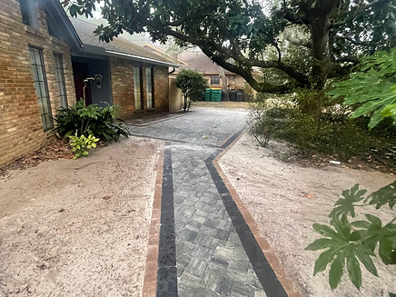 Luxury landscaping with sod, irrigation, artificial turf, pavers, and outdoor living by Turf Tailors in Fort Walton Beach, Destin, Santa Rosa beach, Niceville. 