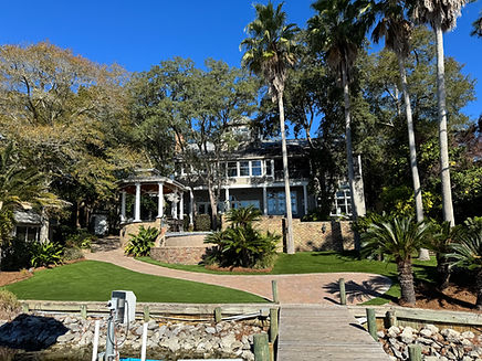 Luxury landscaping with sod, irrigation, artificial turf, pavers, and outdoor living by Turf Tailors in Fort Walton Beach, Destin, Santa Rosa beach, Niceville.