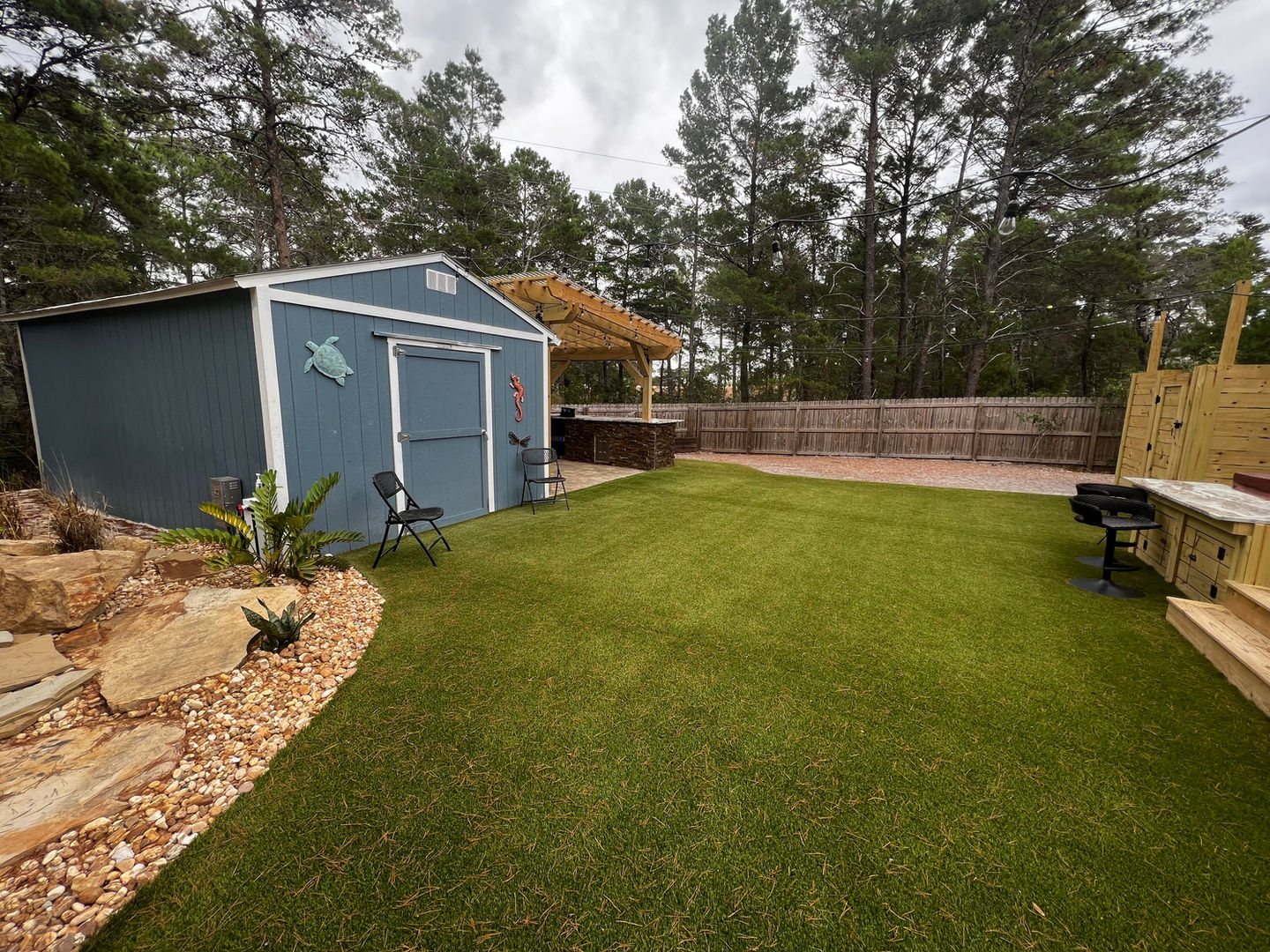 Luxury landscaping with sod, irrigation, artificial turf, pavers, and outdoor living by Turf Tailors in Santa Rosa Beach.