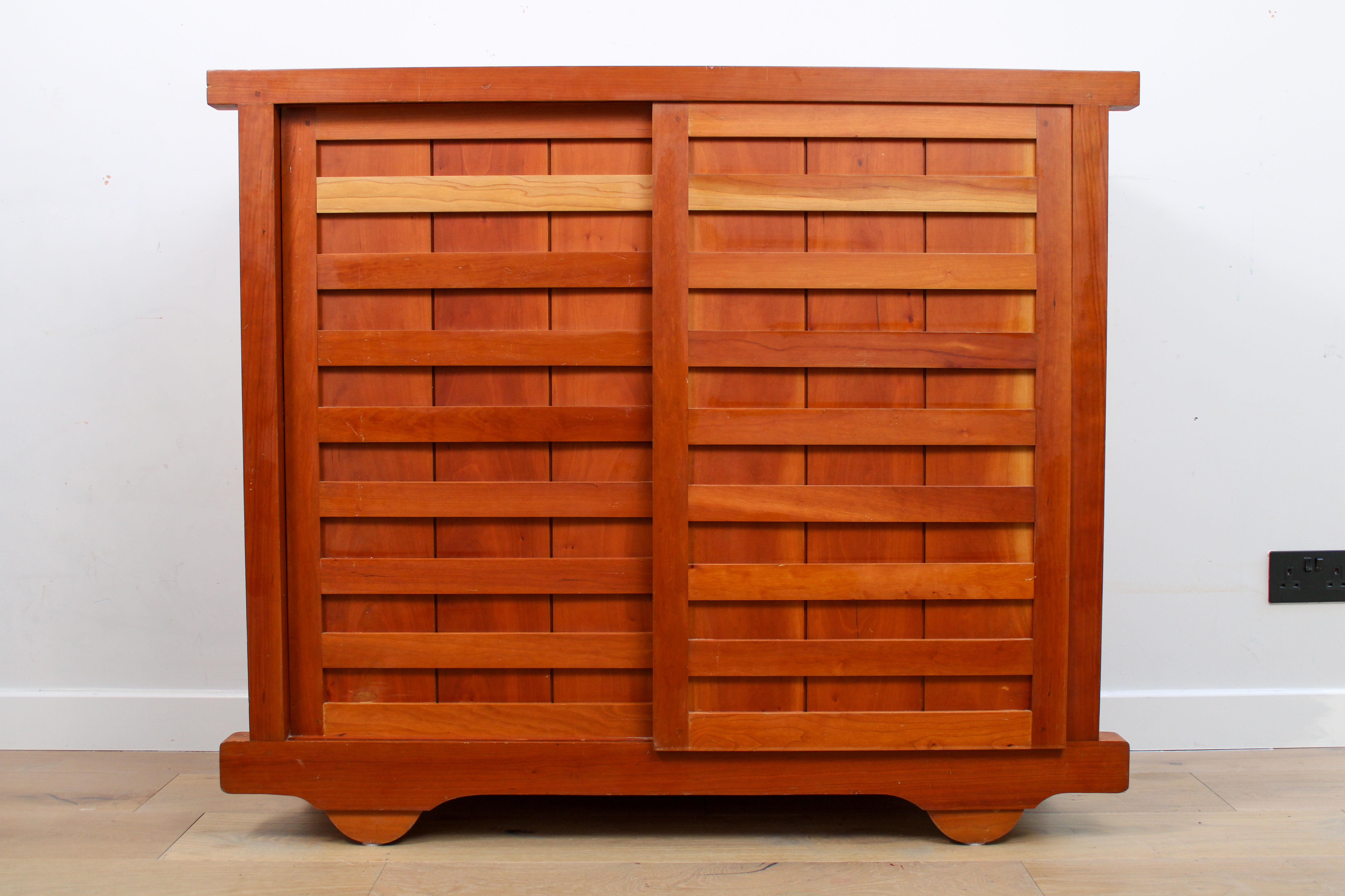 A Japanese inspired storage unit by De La Espada with sliding wooden doors