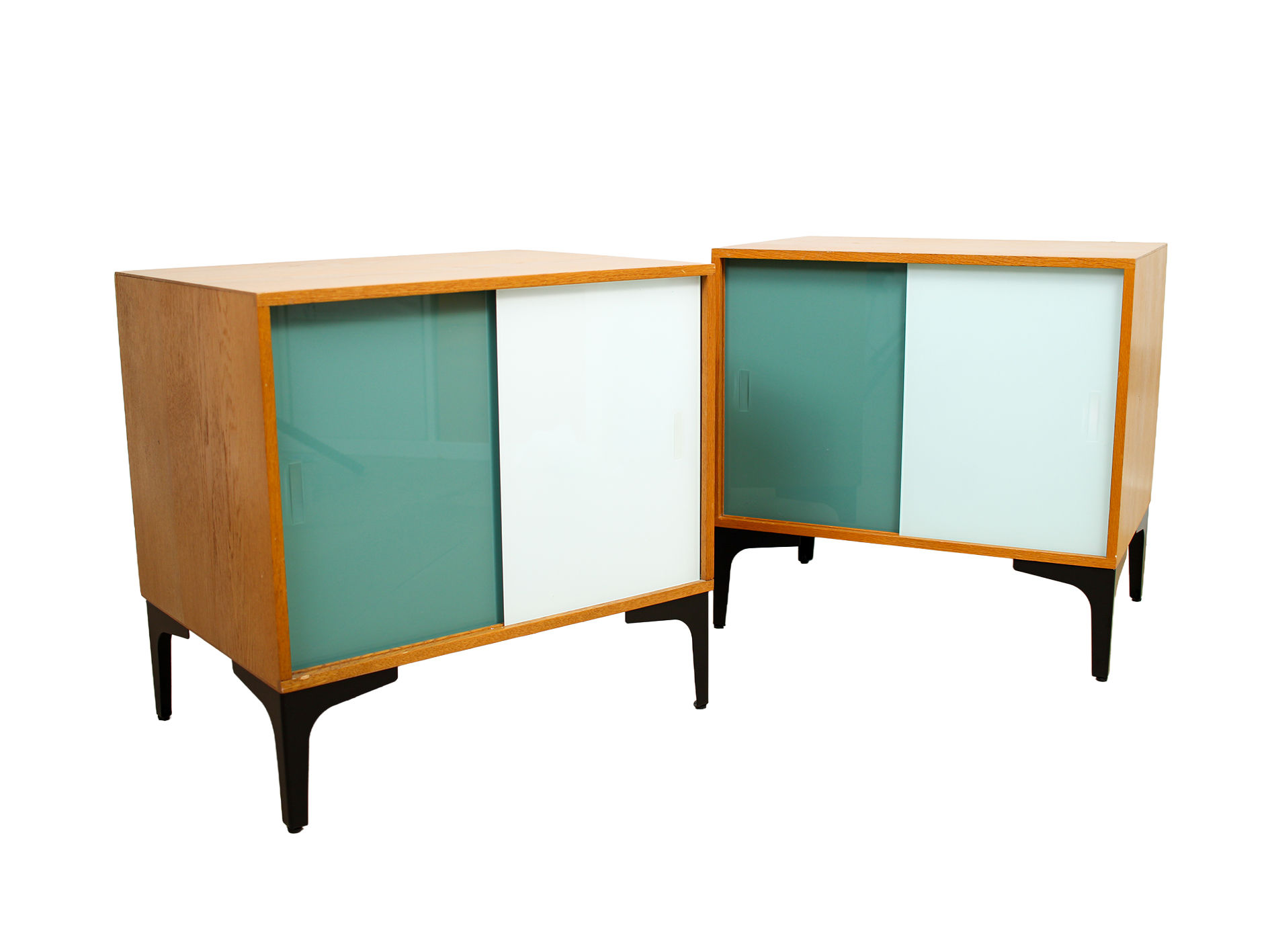 A pair of vintage mid-century bedside tables with glass sliding doors