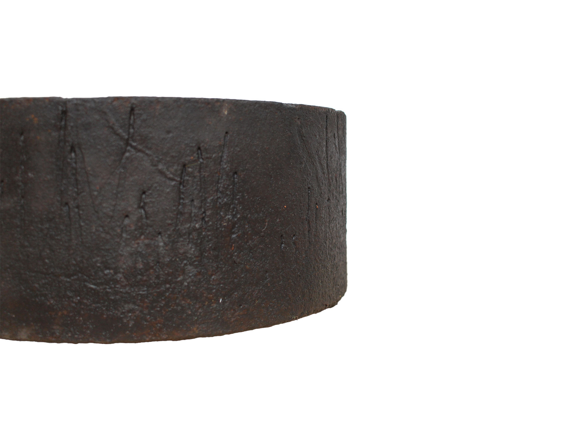 A vintage mid-century brutalist cast iron plant pot