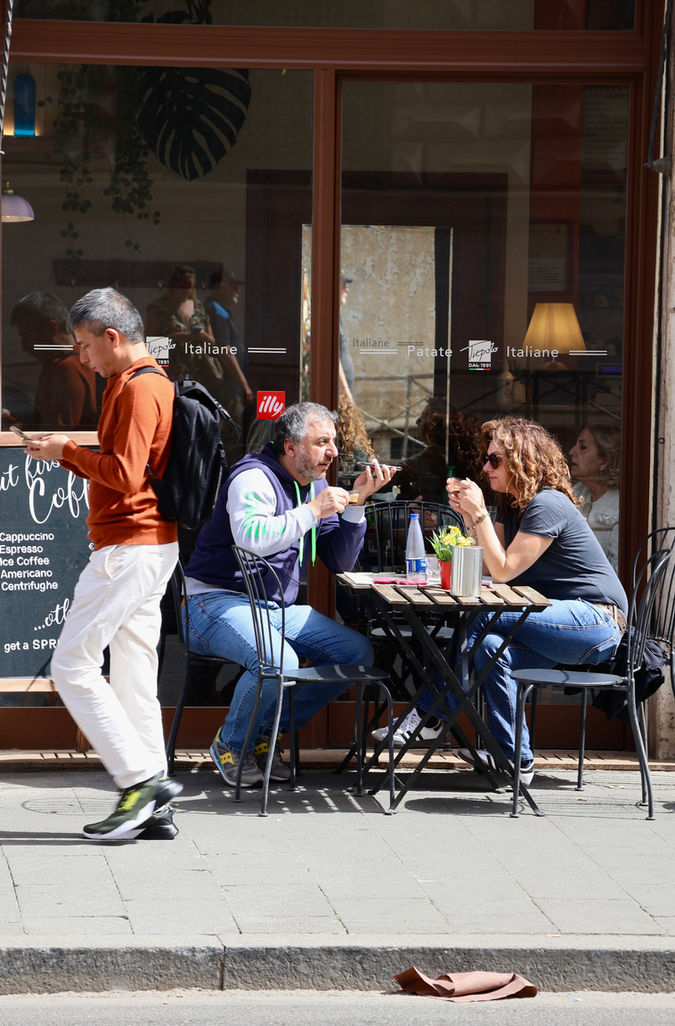 People enjoying coffee at an outdoor cafe, Trastevere, Roma, Italy