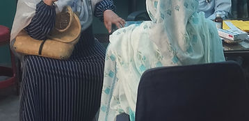 Doctor Talking to Boy in Wheelchair