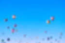 Hot air balloon festival in wadi rum showing lots of hor air balloons flying in a clear blue sky