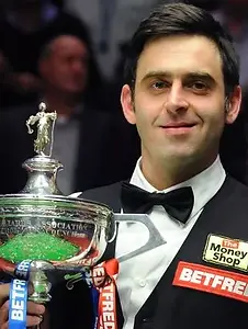 11708921_England's Ronnie O'Sullivan celebrates with the trophy after his victory in the f