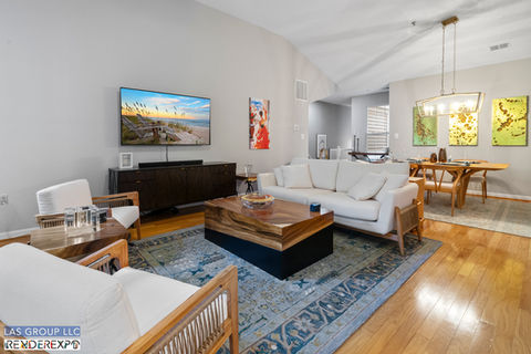 Luxurious modern condo living room with elegant furnishings.