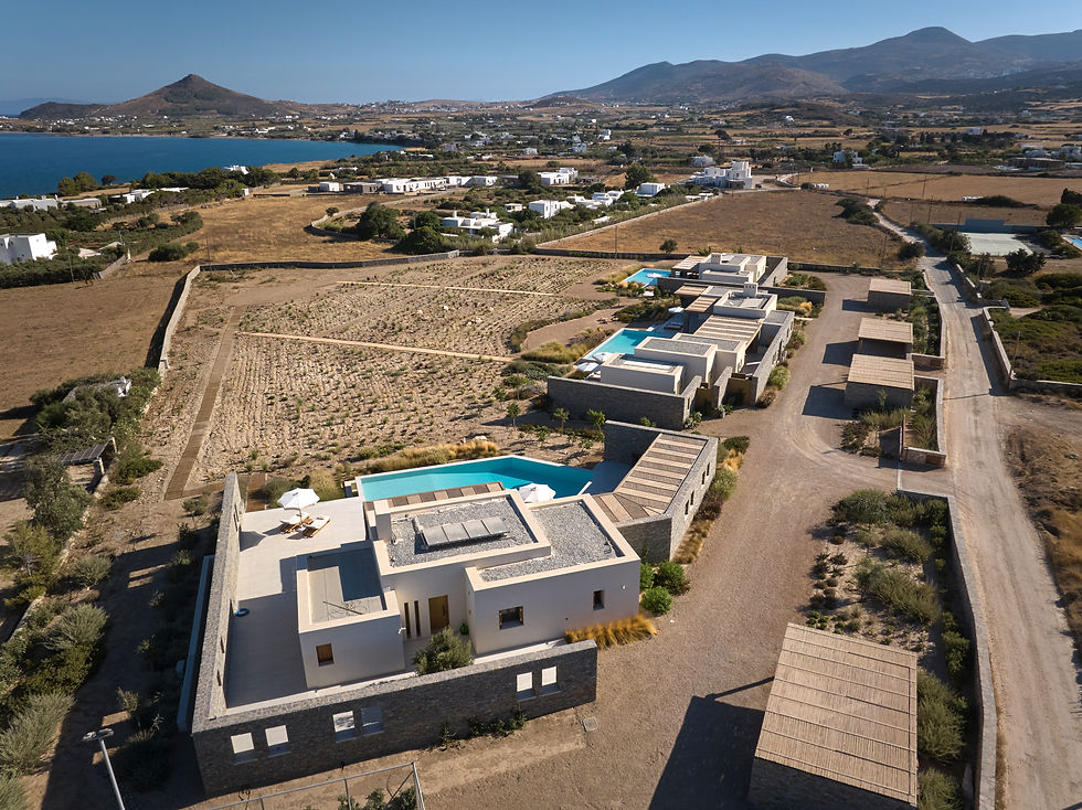 Aerial view of TREĪS Estate with the three villas, the pools and the Mediterannean garden, illustrating the spaciousness of Isterni compared to Naoussa hotels