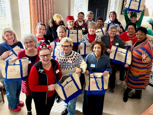 Our METsters celebrating with the winning tote design created by Women at Microsoft.