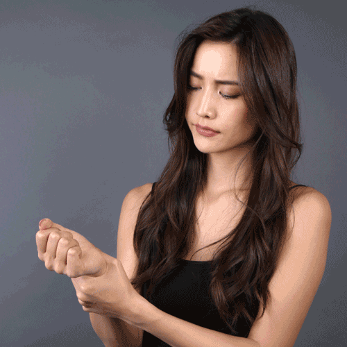 model-in-pain-wears-wrist-aid-64.gif