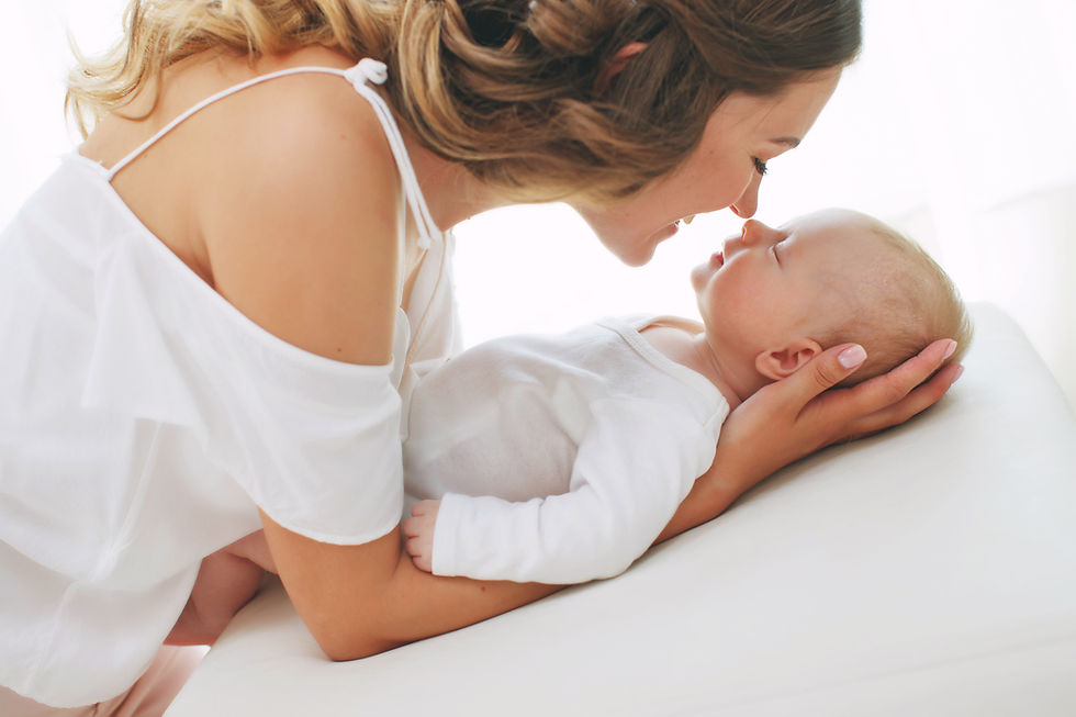 A new mom enjoying her newborn after therapy for moms.