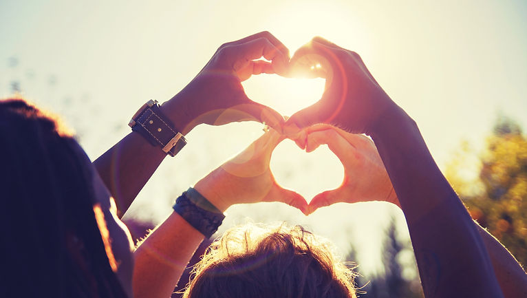 Couple making hearts up to sky | marriage counseling and couples therapy in Coral Springs, FL | Marriage Counseling and Couples Therapy in Fort Lauderdale, FL | couples therapist | LGBTQ couples therapy | LGBTQ couples counseling | 33301 | 33316 | 33308 | 33306 | 33076