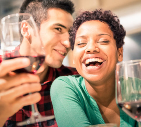 Young couple drinks wine and hugs.jpg