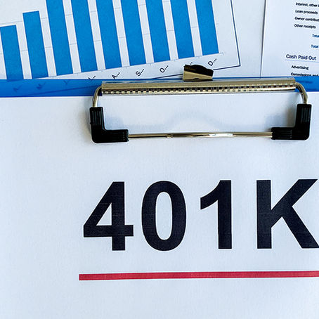 Clipboard with "401K" over financial charts and glasses. Blue bar graph and numerical data visible, suggesting a financial theme.