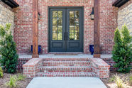Exterior entryway and brickwork for Hillside home