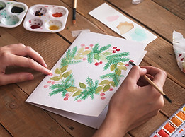 young-woman-painting-christmas-card-with-water-col-2024-09-16-20-31-09-utc.jpg