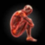 Human suffering with chronic pain, seated in fetal position on a dark background, evoking a reflective mood.