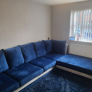 Bespoke deep blue velvet sectional sofa custom built from scratch by A2Z Upholstery in Chorlton, Manchester, designed to perfectly fit the living room space with luxury upholstery finish