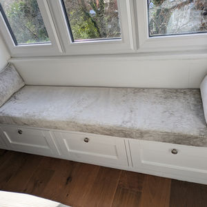 Bespoke window seat upholstery made to measure using customer supplied fabric, professionally fitted by A2Z Upholstery in Manchester for a custom bench seating area